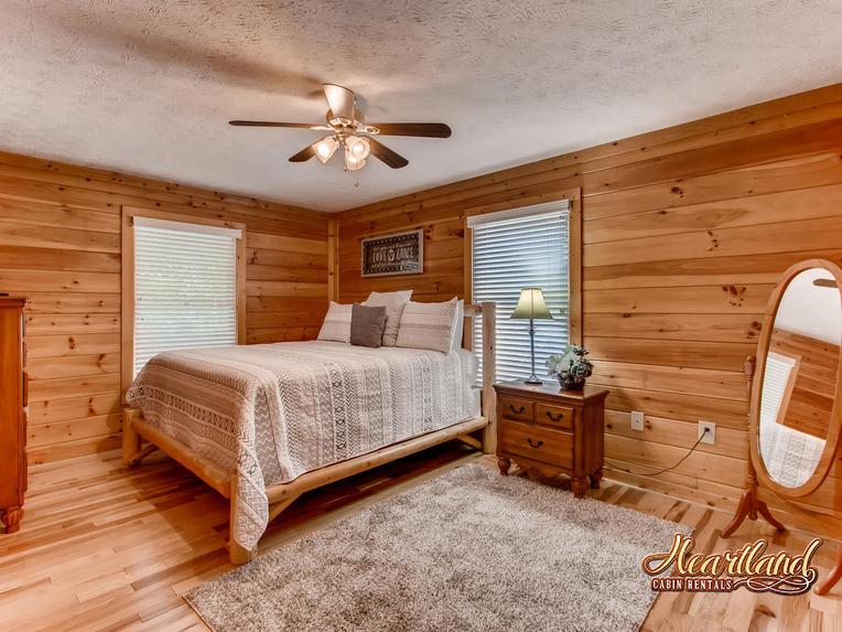 Spacious king bedroom of this 2 bedroom cabin in Pigeon Forge